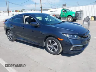 2020 Honda Civic LX with VIN 2HGFC2F63LH594657, listed as a IAAI auction lot 41848156 with 61,241 mi miles and . Bid and sale history available at DreamBid. Image 1.