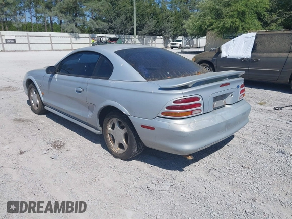 1995 Ford Mustang with VIN 1FALP4047SF170414, listed as a IAAI auction lot 42079990 with 106,398 mi miles. Bid and sale history available at carsss.com. Image 3.