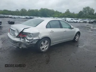 2006 Acura RL z VIN JH4KB16526C005279, wystawiony jako Copart lot #57917835 z przebiegiem 145 737 mil mil oraz Szkody całkowita. Historia ofert i sprzedaży dostępna na DreamBid. Obrazek 3.