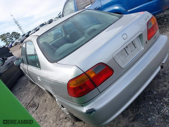 1999 Honda Civic EX with VIN 2HGEJ8649XH590637, listed as a IAAI auction lot 41584579 with 184,999 mi miles. Bid and sale history available at carsss.com. Image 3.