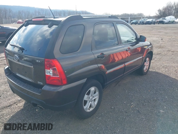 2009 Kia Sportage LX with VIN KNDJE723097623239, listed as a IAAI auction lot 41233933 with 169,444 mi miles. Bid and sale history available at carsss.com. Image 4.