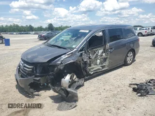 2014 Honda Odyssey EX-L with VIN 5FNRL5H62EB112280, listed as a Copart auction lot 60138645 with 167,657 mi miles and Salvage title. Bid and sale history available at DreamBid. Image 1.