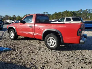 2002 Dodge Dakota with VIN 1B7FL16X42S720579, listed as a Copart auction lot 88160015 with 164,279 mi miles and Salvage Title. Bid and sale history available at carsss.com. Image 2.