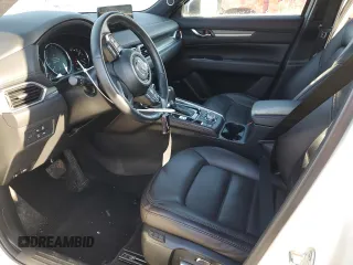 2021 Mazda CX-5 Signature with VIN JM3KFBEY5M0447759, listed as a Copart auction lot 42565535 with 24,175 mi miles and Salvage Title. Bid and sale history available at carsss.com. Image 7.