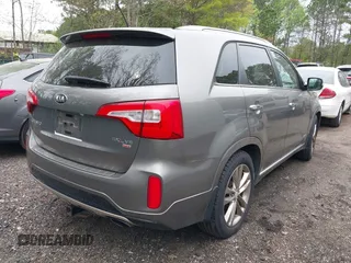 2015 Kia Sorento SX with VIN 5XYKWDA75FG553286, listed as a IAAI auction lot 42020351 with 147,572 mi miles. Bid and sale history available at carsss.com. Image 4.