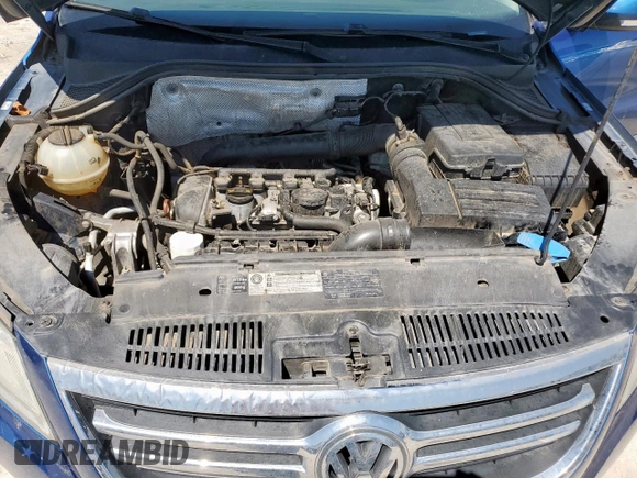 2010 Volkswagen Tiguan Wolfsburg Edition z VIN WVGAV7AXXAW004058, wystawiony jako Copart lot #50976575 z przebiegiem 83 620 mil mil oraz Szkoda całkowita • Salvage title. Historia ofert i sprzedaży dostępna na DreamBid. Obrazek 12.