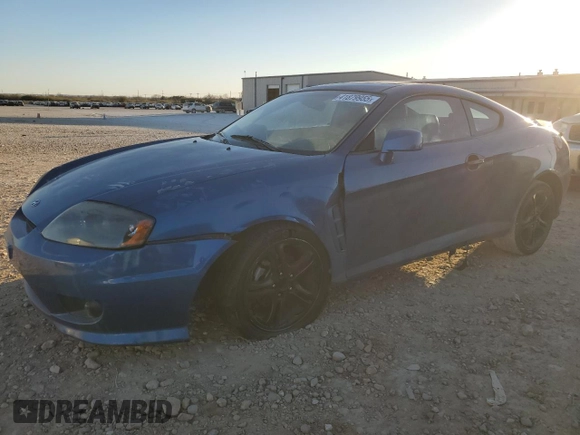 2005 Hyundai Tiburon GT z VIN KMHHN65F35U186438, wystawiony jako Copart lot #41879955 z przebiegiem 152 574 mil mil oraz Szkoda całkowita • Salvage title. Historia ofert i sprzedaży dostępna na DreamBid. Obrazek 1.