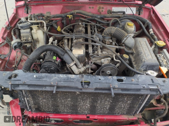 1999 Jeep Cherokee Sport with VIN 1J4FF68S2XL648735, listed as a Copart auction lot 58758115 with 252,248 mi miles and Salvage title. Bid and sale history available at DreamBid. Image 12.