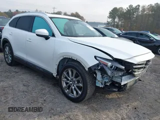 2016 Mazda CX-9 Grand Touring with VIN JM3TCBDY3G0116309, listed as a IAAI auction lot 40890199 with 64,948 mi miles. Bid and sale history available at carsss.com. Image 1.