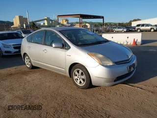 2006 Toyota Prius z VIN JTDKB20U863143464, wystawiony jako IAAI lot #41777923 z przebiegiem 118 252 mil mil oraz . Historia ofert i sprzedaży dostępna na DreamBid. Obrazek 1.
