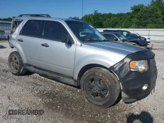 2010 Ford Escape XLS with VIN 1FMCU0C73AKA52802, listed as a Copart auction lot 60100185 with 141,541 mi miles and Clean title. Bid and sale history available at DreamBid. Image 4.