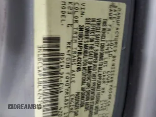 2011 Nissan Versa S z VIN 3N1BC1AP1BL424748, wystawiony jako Copart lot #59333105 z przebiegiem 167 489 mil mil oraz Szkoda całkowita • Salvage title. Historia ofert i sprzedaży dostępna na DreamBid. Obrazek 12.