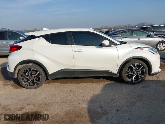 2021 Toyota C-HR LE with VIN JTNKHMBXXM1099019, listed as a IAAI auction lot 41525170 with 63,519 mi miles. Bid and sale history available at carsss.com. Image 13.