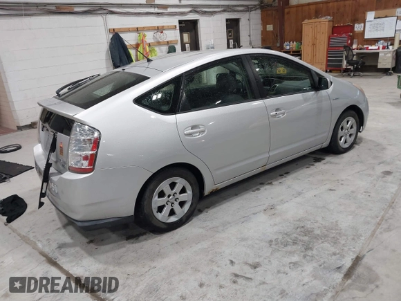2007 Toyota Prius z VIN JTDKB20U977649489, wystawiony jako IAAI lot #41772600 z przebiegiem 248 525 mil mil oraz . Historia ofert i sprzedaży dostępna na DreamBid. Obrazek 4.