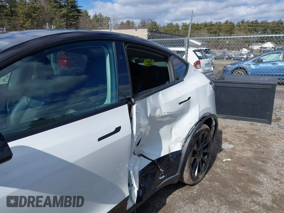 2023 Tesla Model Y Long Range with VIN 7SAYGDEE7PF832007, listed as a IAAI auction lot 41751598 with 14,126 mi miles and . Bid and sale history available at DreamBid. Image 6.