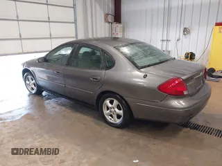 2003 Ford Taurus SE Standard z VIN 1FAFP53UX3G167579, wystawiony jako IAAI lot #42140606 z przebiegiem 178 147 mil mil oraz . Historia ofert i sprzedaży dostępna na DreamBid. Obrazek 3.