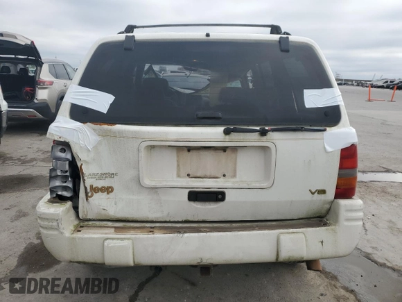 1997 Jeep Grand Cherokee Limited with VIN 1J4GX78YXVC716353, listed as a Copart auction lot 85207974 with 115,527 mi miles and Salvage Title. Bid and sale history available at carsss.com. Image 6.