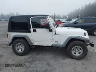 2006 Jeep Wrangler Sport Right Hand Drive with VIN 1J4F449S16P709895, listed as a IAAI auction lot 41349311 with 157,125 mi miles. Bid and sale history available at carsss.com. Image 13.