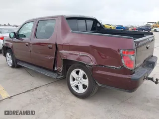 2014 Honda Ridgeline RTL with VIN 5FPYK1F52EB010700, listed as a IAAI auction lot 41490401 with 180,947 mi miles. Bid and sale history available at carsss.com. Image 3.