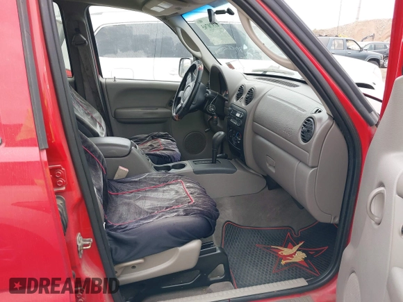 2003 Jeep Liberty Sport with VIN 1J4GL48K23W660989, listed as a IAAI auction lot 40370765 with 166,297 mi miles. Bid and sale history available at carsss.com. Image 5.