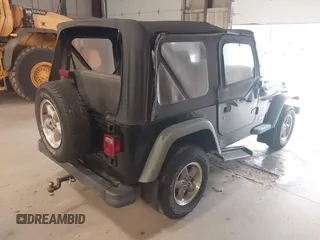 1999 Jeep Wrangler SE with VIN 1J4FY29PXXP409455, listed as a IAAI auction lot 42234313 with 56,252 mi miles and . Bid and sale history available at DreamBid. Image 4.