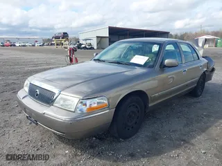 2005 Mercury Grand Marquis GS with VIN 2MEFM74W55X603152, listed as a IAAI auction lot 41872534 with 84,290 mi miles. Bid and sale history available at carsss.com. Image 2.