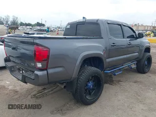 2018 Toyota Tacoma SR5 with VIN 5TFAZ5CNXJX066952, listed as a IAAI auction lot 41894562 with 141,818 mi miles and . Bid and sale history available at DreamBid. Image 4.