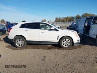 2012 Cadillac SRX Luxury Collection z VIN 3GYFNAE37CS576292, wystawiony jako IAAI lot #41048054 z przebiegiem 158 948 mil mil oraz . Historia ofert i sprzedaży dostępna na DreamBid. Obrazek 13.