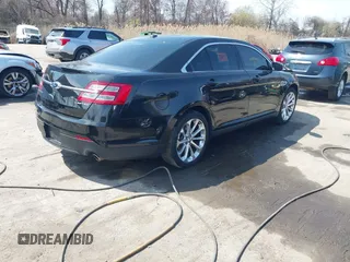 2014 Ford Taurus Limited with VIN 1FAHP2F80EG104984, listed as a IAAI auction lot 41910463 with 174,034 mi miles. Bid and sale history available at carsss.com. Image 4.