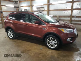 2018 Ford Escape SE z VIN 1FMCU9GD2JUA21582, wystawiony jako Copart lot #56165155 z przebiegiem 88 881 mil mil oraz Czysty tytuł • Clean title. Historia ofert i sprzedaży dostępna na DreamBid. Obrazek 4.