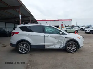 2013 Ford Escape SEL with VIN 1FMCU0H99DUB83641, listed as a IAAI auction lot 41578882 with 124,872 mi miles. Bid and sale history available at carsss.com. Image 13.