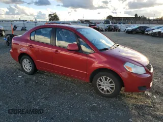 2013 Suzuki SX4 LE with VIN JS2YC5A37D6101819, listed as a Copart auction lot 82367044 with 142,932 mi miles and Salvage Title. Bid and sale history available at carsss.com. Image 4.