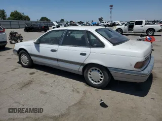 1989 Ford Taurus GL z VIN 1FABP52UXKG244224, wystawiony jako Copart lot #59239225 z przebiegiem 30 853 mil mil oraz Czysty tytuł • Clean title. Historia ofert i sprzedaży dostępna na DreamBid. Obrazek 2.