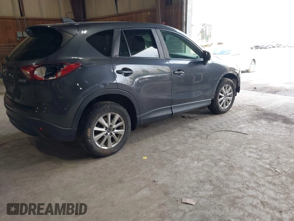 2015 Mazda CX-5 Touring with VIN JM3KE4CY6F0510002, listed as a IAAI auction lot 42045284 with 88,949 mi miles and . Bid and sale history available at DreamBid. Image 4.