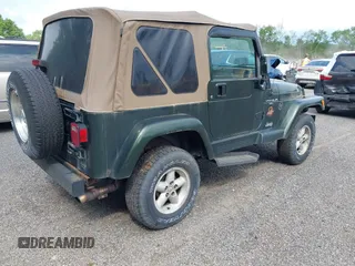 1998 Jeep Wrangler Sahara z VIN 1J4FY49SXWP716218, wystawiony jako IAAI lot #42354433 z przebiegiem 234 378 mil mil oraz . Historia ofert i sprzedaży dostępna na DreamBid. Obrazek 4.