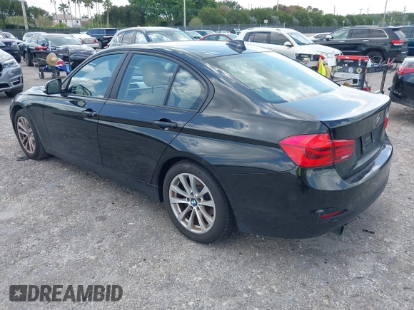 2018 BMW 3 Series 320i with VIN WBA8E1G57JNU88781, listed as a IAAI auction lot 42019246 with 56,820 mi miles. Bid and sale history available at carsss.com. Image 3.
