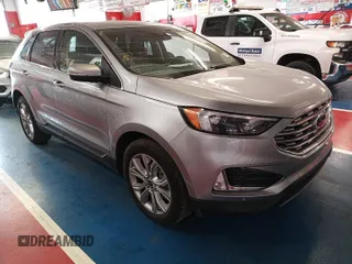 2022 Ford Edge Titanium z VIN 2FMPK4K98NBA82041, wystawiony jako IAAI lot #42408903 z przebiegiem 93 654 mil mil oraz . Historia ofert i sprzedaży dostępna na DreamBid. Obrazek 1.