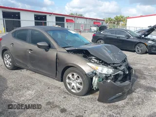2014 Mazda 3 i Sport with VIN JM1BM1U75E1121358, listed as a IAAI auction lot 42137298 with 163,722 mi miles and . Bid and sale history available at DreamBid. Image 1.