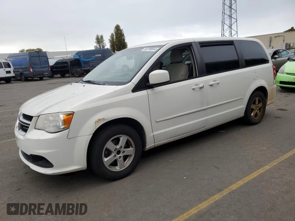 2012 Dodge Grand Caravan SXT with VIN 2C4RDGCG6CR204681, listed as a Copart auction lot 80799044 with 183,195 mi miles and Salvage Title. Bid and sale history available at DreamBid. Image 1.