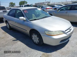 1998 Honda Accord LX with VIN 1HGCG5649WA254293, listed as a IAAI auction lot 42669800 with 221,690 mi miles and . Bid and sale history available at DreamBid. Image 1.