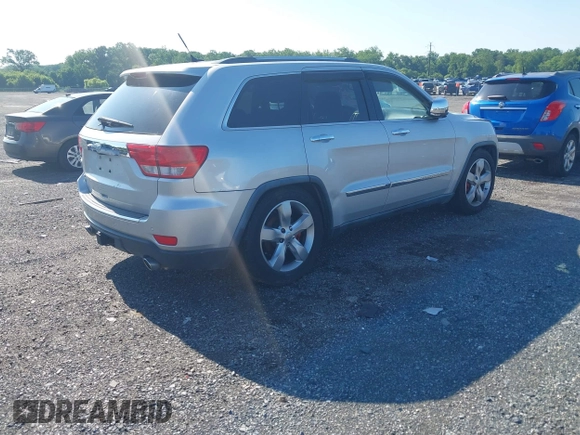 2011 Jeep Grand Cherokee Overland Summit with VIN 1J4RR6GT9BC535985, listed as a IAAI auction lot 42556913 with 108,845 mi miles and . Bid and sale history available at DreamBid. Image 4.