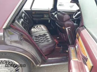 1985 Cadillac Seville z VIN 1G6KS6989FE821515, wystawiony jako IAAI lot #42009508 z przebiegiem 13 600 mil mil oraz . Historia ofert i sprzedaży dostępna na DreamBid. Obrazek 8.