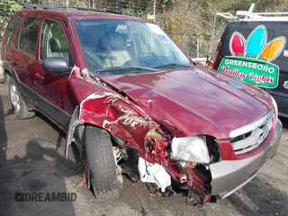 2003 Mazda Tribute ES with VIN 4F2CZ06153KM56524, listed as a IAAI auction lot 41104529 with 127,457 mi miles. Bid and sale history available at carsss.com. Image 1.