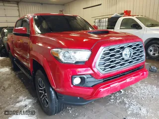 2020 Toyota Tacoma 4WD SR5 with VIN 3TMCZ5AN1LM340379, listed as a IAAI auction lot 41612351 with 67,799 mi miles. Bid and sale history available at carsss.com. Image 1.