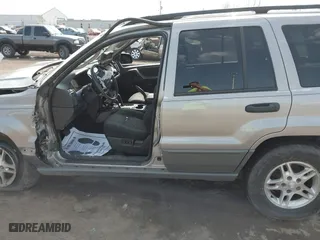 2002 Jeep Grand Cherokee Laredo with VIN 1J4GW48N42C188117, listed as a IAAI auction lot 41794232 with 1 mi miles. Bid and sale history available at carsss.com. Image 14.