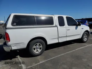 2000 Ford F-150 XL with VIN 1FTZX172XYNC01869, listed as a Copart auction lot 47414095 with 0 mi miles and Salvage Title. Bid and sale history available at carsss.com. Image 3.
