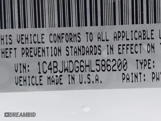 2017 Jeep Wrangler Unlimited Sport with VIN 1C4BJWDG6HL586200, listed as a IAAI auction lot 41723891 with 125,291 mi miles. Bid and sale history available at carsss.com. Image 9.