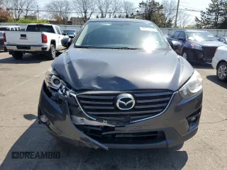 2016 Mazda CX-5 Touring with VIN JM3KE2CY2G0612029, listed as a Copart auction lot 53810155 with 159,915 mi miles and Salvage Title. Bid and sale history available at DreamBid. Image 5.