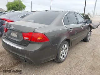 2009 Kia Optima LX with VIN KNAGE228X95299444, listed as a IAAI auction lot 41953241 with 201,170 mi miles. Bid and sale history available at carsss.com. Image 4.