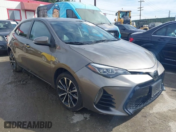 2017 Toyota Corolla L z VIN 5YFBURHE5HP730912, wystawiony jako IAAI lot #41610019 z przebiegiem 61 440 mil mil oraz . Historia ofert i sprzedaży dostępna na DreamBid. Obrazek 1.